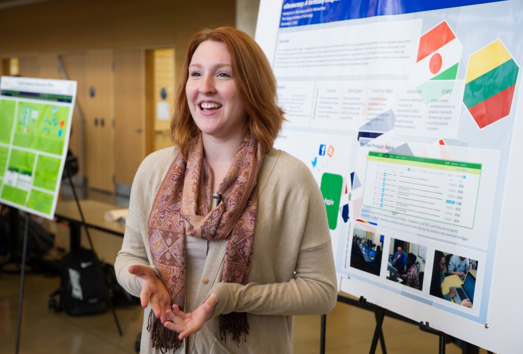 Women in front of presentation board